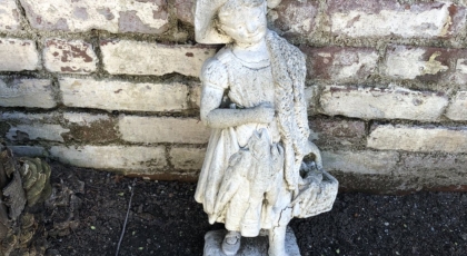 A statue of a little girl I spotted in an alley