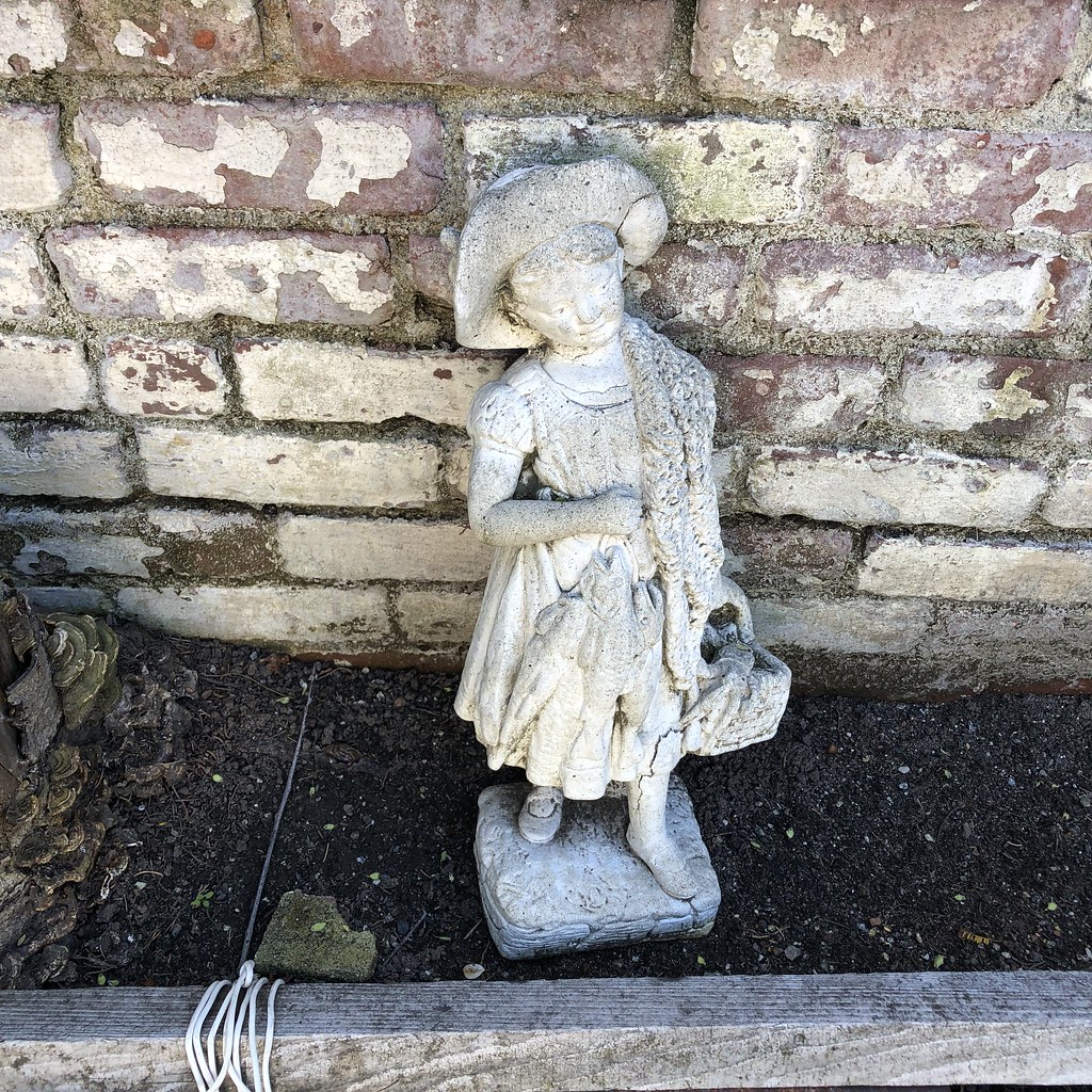 A statue of a little girl I spotted in an alley